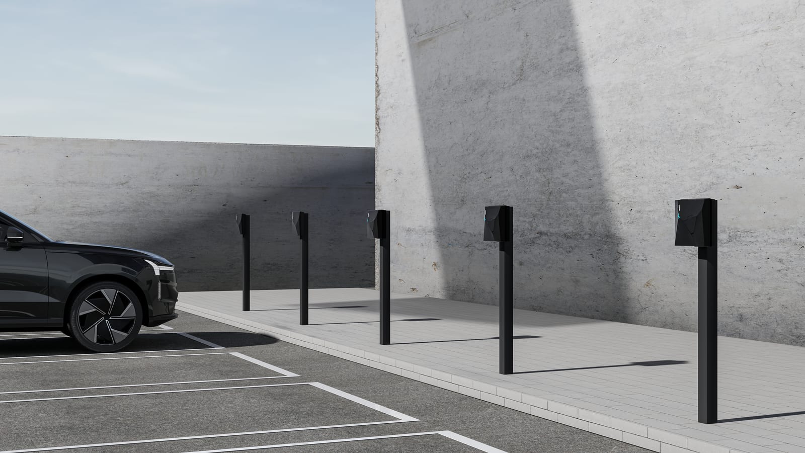 Rij NexBlue laadpunten op zuil langs de parkeervakken van een parking